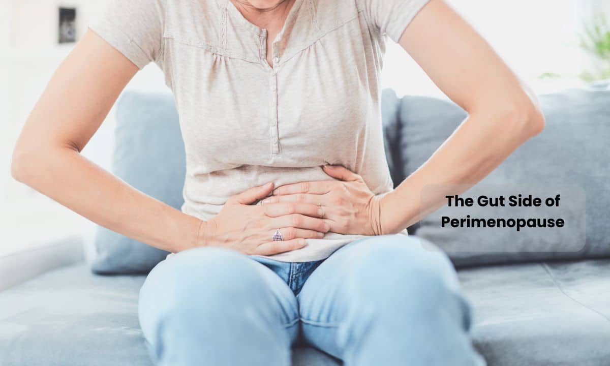 Woman experiencing stomach discomfort during perimenopause