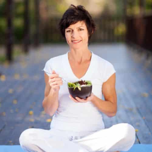 Woman eating salad