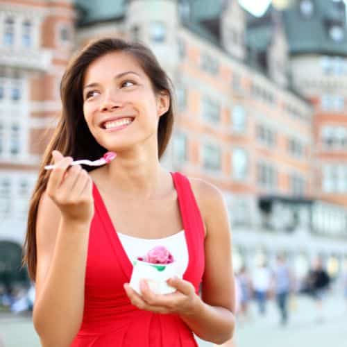 Woman eating small ice cream